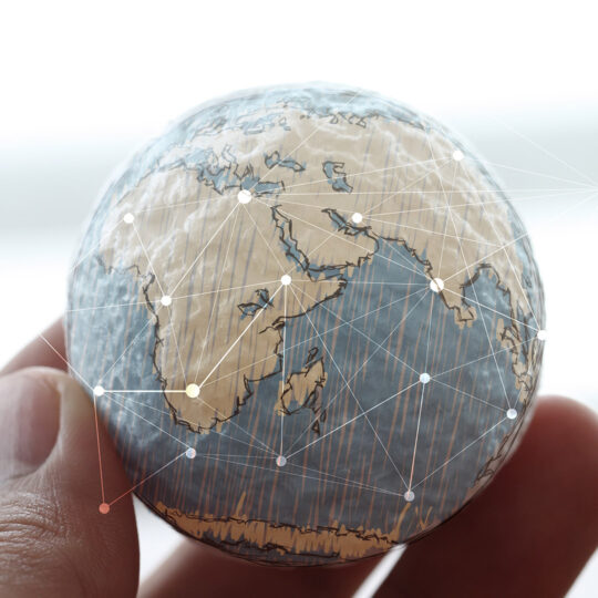 hand holding a globe network hand holding a globe network